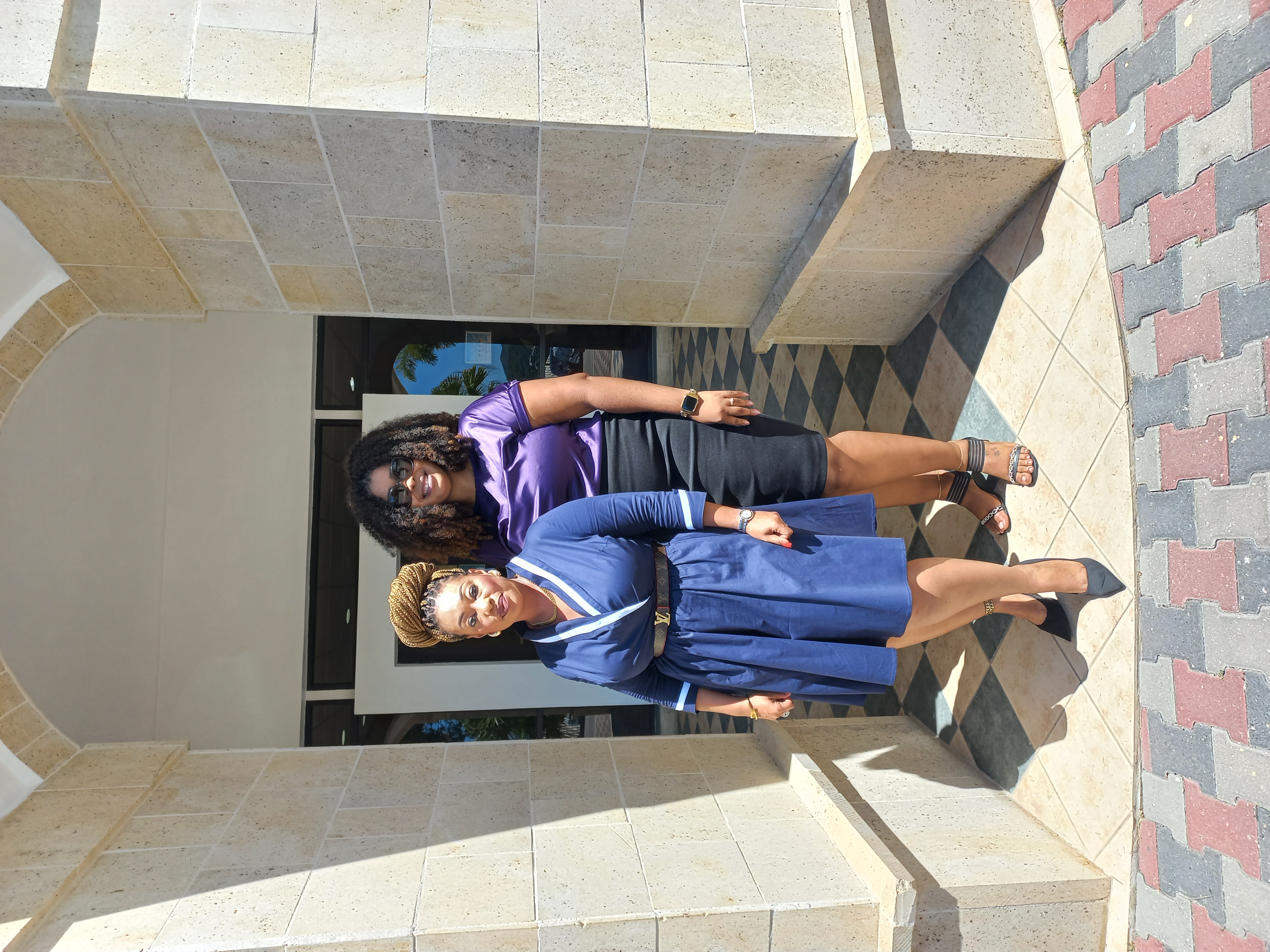 From left to right, Ms. Joy-Marie King and Mrs. Andrea Andrew at the Office of the Prime Minister in Antigua and Barbuda.