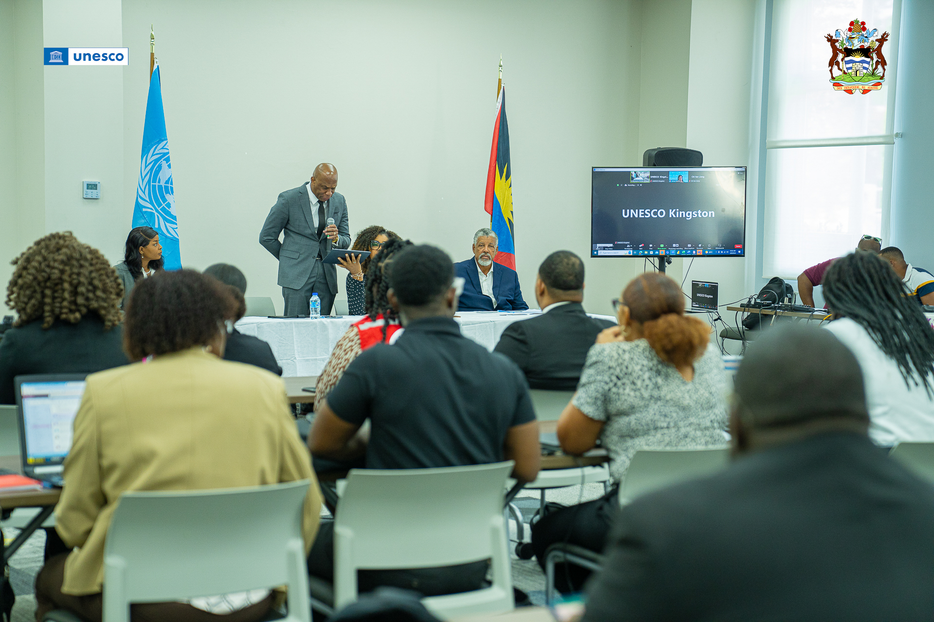 A photo of youth stakeholders from listening to Mr. Browne’s opening remarks from the back of the room.